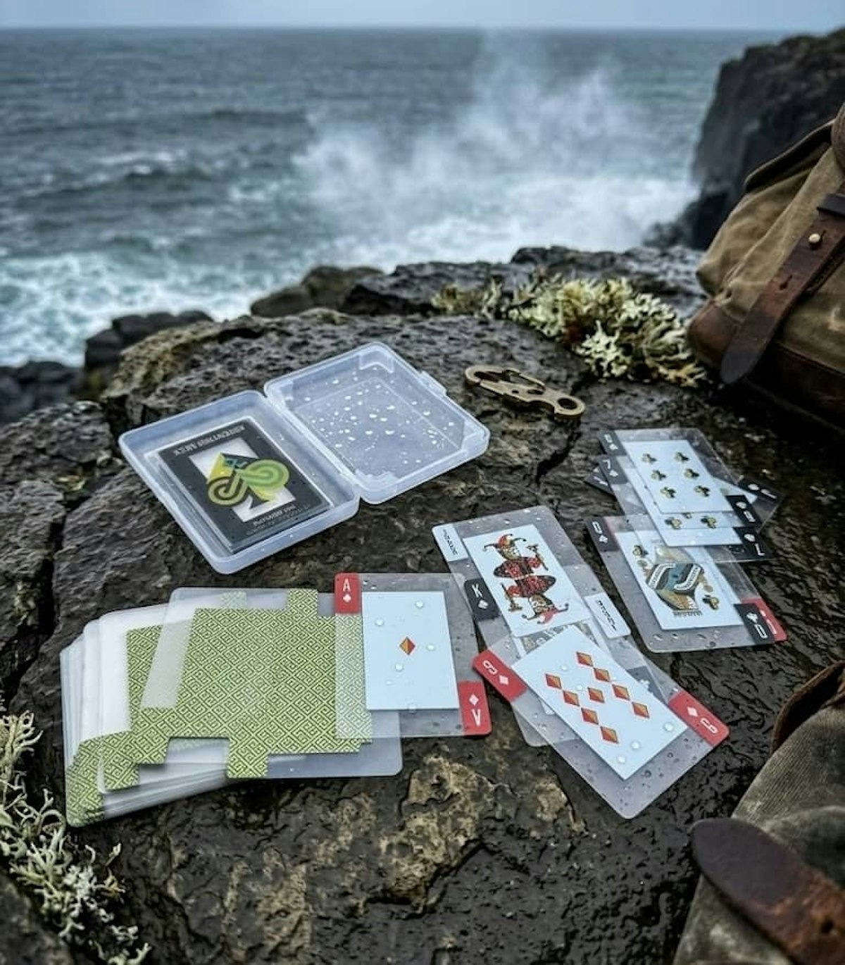 AI generated image of cards on a rocky ocean cliff