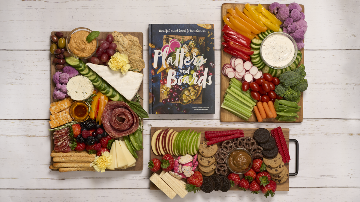 Many serving boards with 'Platters and Boards' book