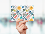 Hand holding card with international travel iconography and text 'Travel' and 'Bon Voyage'