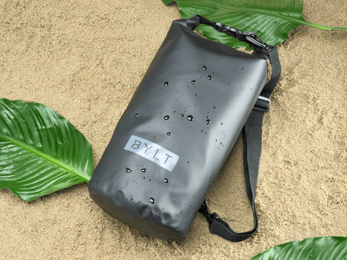 Wet Bylt Dry Bag on ground with palm fronds